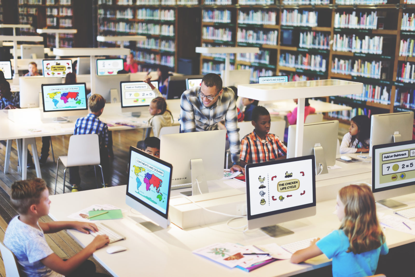 Image of children studying with computers