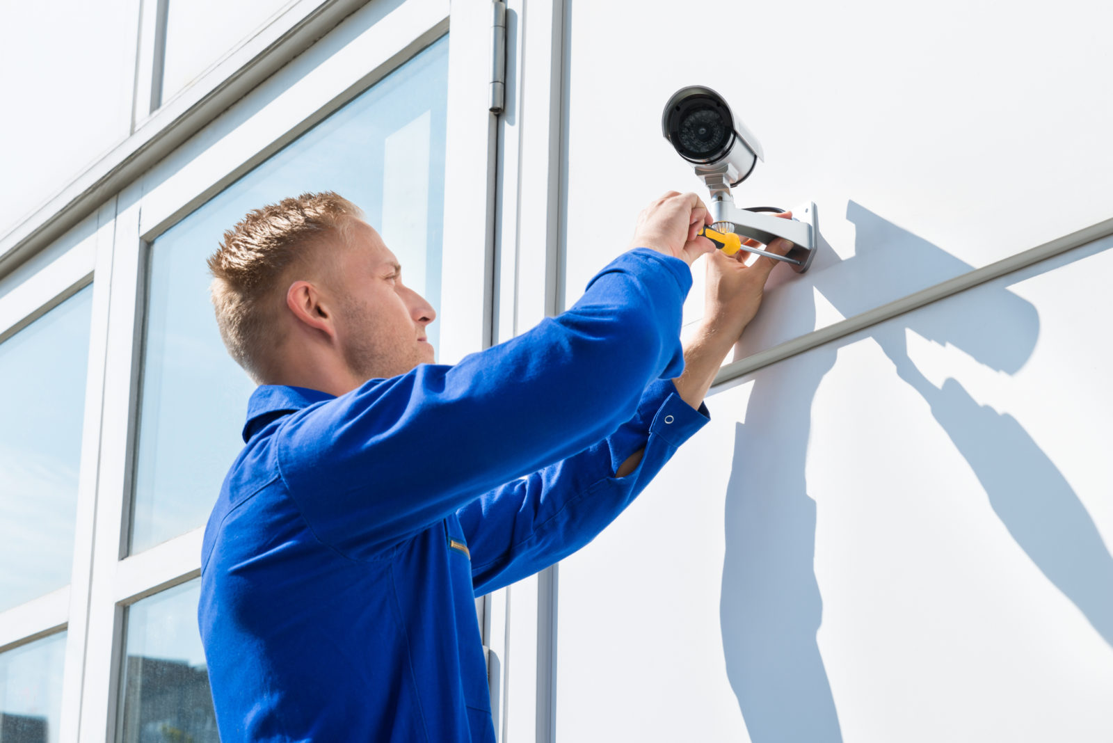 Image of a man installing a CCTV camera